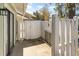 Enclosed patio area featuring a white fence and storage shed for outdoor convenience at 1470 Turkey Ridge Dr. # D, Myrtle Beach, SC 29575