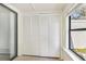 Storage unit with paneled closet doors on tiled floors and bright light at 1470 Turkey Ridge Dr. # D, Myrtle Beach, SC 29575