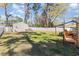 Large, green backyard with a storage shed and a wooden deck; fully fenced for privacy at 150 Brookgate Dr., Myrtle Beach, SC 29579