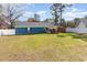 Spacious backyard showcasing the home's exterior, outdoor deck, and a secure privacy fence at 150 Brookgate Dr., Myrtle Beach, SC 29579