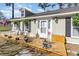 Welcoming front porch with rocking chairs and potted plants offers a charming curb appeal at 150 Brookgate Dr., Myrtle Beach, SC 29579
