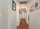 Hallway with wood floors, gray walls, and decorated with picture frames at 150 Brookgate Dr., Myrtle Beach, SC 29579