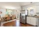 Bright kitchen with stainless appliances, wooden floors, a dining area and large windows at 150 Brookgate Dr., Myrtle Beach, SC 29579