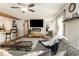 Spacious living room with hardwood floors, a stylish fireplace, and an open layout to the kitchen at 150 Brookgate Dr., Myrtle Beach, SC 29579