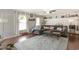 Cozy living room featuring a stylish area rug, comfortable seating, and plenty of natural light at 150 Brookgate Dr., Myrtle Beach, SC 29579