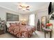 Comfortable main bedroom with bed, window, and decorative art at 150 Brookgate Dr., Myrtle Beach, SC 29579