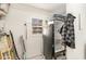 Bright storage area featuring a refrigerator, shelving, and a window for natural light at 150 Brookgate Dr., Myrtle Beach, SC 29579