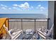 Balcony view with seating for two overlooking the ocean. Perfect for relaxing and enjoying the scenery at 1501 S Ocean Blvd. # 1042, Myrtle Beach, SC 29577