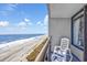 This charming balcony offers stunning ocean views and a serene seating area to enjoy the seascape at 1501 S Ocean Blvd. # 1042, Myrtle Beach, SC 29577