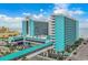 Stunning exterior view of a blue and white Landmark Resort, capturing its architectural design and coastal charm at 1501 S Ocean Blvd. # 1042, Myrtle Beach, SC 29577