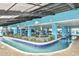 Indoor lazy river with lush greenery, inviting waters, and a relaxing resort atmosphere at 1501 S Ocean Blvd. # 1042, Myrtle Beach, SC 29577