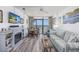 Comfortable living room featuring fireplace, TV, dining set, and ocean views at 1501 S Ocean Blvd. # 1042, Myrtle Beach, SC 29577