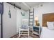 Interior view of bedroom with rocker, ladder, side table, and stylish beach-themed decor at 1501 S Ocean Blvd. # 1042, Myrtle Beach, SC 29577