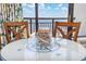 Close-up of a nautical-themed table with ocean view through sliding glass door at 1501 S Ocean Blvd. # 1042, Myrtle Beach, SC 29577