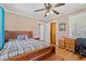Comfortable bedroom with hardwood floors, ceiling fan, and double-door closet at 1502 Mckeithan St., Conway, SC 29526