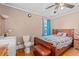 Bedroom features hardwood floors, sink, toilet, and wood-framed bed at 1502 Mckeithan St., Conway, SC 29526