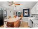 Open kitchen featuring island with seating, adjacent living room and dining area at 1502 Mckeithan St., Conway, SC 29526