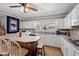 Bright kitchen with white cabinets, tiled backsplash, and laminate flooring at 1502 Mckeithan St., Conway, SC 29526