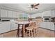 Cozy kitchen with island, ceiling fan, and white cabinets with stainless steel oven at 1502 Mckeithan St., Conway, SC 29526