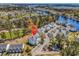 Aerial shot of condo building, with mature trees, water views, other condos and plenty of parking at 1505 Lanterns Rest Rd. # 101, Myrtle Beach, SC 29579