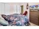 Well-lit bedroom with closet and large screen tv at 1505 Lanterns Rest Rd. # 101, Myrtle Beach, SC 29579