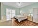 Large bedroom with sliding glass doors and neutral decor at 1505 Lanterns Rest Rd. # 101, Myrtle Beach, SC 29579