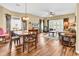 Inviting dining room with wood floors, table with seating for six, and views into the living room at 1505 Lanterns Rest Rd. # 101, Myrtle Beach, SC 29579