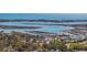 Expansive aerial view of waterfront with shops, marina, and the sparkling ocean, offering endless outdoor opportunities at 154 Sea Shell Dr. # 16, Murrells Inlet, SC 29576