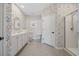 Modern bathroom features designer wallpaper, a glass door shower, and tile flooring at 154 Sea Shell Dr. # 16, Murrells Inlet, SC 29576