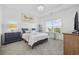 Bright bedroom features a tray ceiling, nice bed, large windows and coastal decorations at 154 Sea Shell Dr. # 16, Murrells Inlet, SC 29576