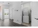 Hallway with hardwood flooring and a laundry closet with a stackable washer and dryer at 154 Sea Shell Dr. # 16, Murrells Inlet, SC 29576
