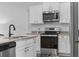 Well lit kitchen with granite countertops, stainless appliances and white subway tile backsplash at 154 Sea Shell Dr. # 16, Murrells Inlet, SC 29576