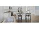 Stylish kitchen with granite counters, island with seating, and stainless steel appliances at 154 Sea Shell Dr. # 16, Murrells Inlet, SC 29576