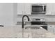 Modern kitchen featuring granite countertops, stainless steel appliances, and stylish white cabinetry at 154 Sea Shell Dr. # 16, Murrells Inlet, SC 29576