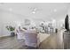 Bright living room with ceiling fan, open floor plan, and view into the kitchen at 154 Sea Shell Dr. # 16, Murrells Inlet, SC 29576
