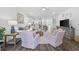 Airy living room featuring modern decor, ceiling fan and view into the dining area at 154 Sea Shell Dr. # 16, Murrells Inlet, SC 29576