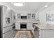 Bright kitchen featuring stainless steel appliances, granite countertops, and white cabinetry at 1625 S Ocean Blvd. # 1510, North Myrtle Beach, SC 29582