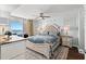 Airy main bedroom with a ceiling fan, balcony access, and beautiful ocean views at 1625 S Ocean Blvd. # 1510, North Myrtle Beach, SC 29582