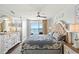 Elegant bedroom featuring a decorative bed frame, ceiling fan, and access to a private balcony at 1625 S Ocean Blvd. # 1510, North Myrtle Beach, SC 29582
