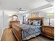 Spacious bedroom showcasing a decorative wood bed frame, ceiling fan, and matching dresser at 1625 S Ocean Blvd. # 1510, North Myrtle Beach, SC 29582