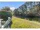 Picturesque backyard featuring lush grass, a waterfront view, and outdoor seating at 173 Knight Circle # 1, Pawleys Island, SC 29585