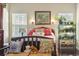 Inviting bedroom showcasing a cozy bed, decorative accents, and ample natural light at 173 Knight Circle # 1, Pawleys Island, SC 29585