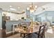 Open dining and living areas offering seamless flow, vaulted ceiling, and natural light at 173 Knight Circle # 1, Pawleys Island, SC 29585