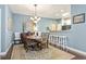 Cozy dining room featuring an elegant chandelier, hardwood floors, and an adjacent breakfast bar at 173 Knight Circle # 1, Pawleys Island, SC 29585