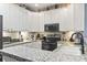Bright kitchen with white cabinetry, stainless steel appliances, and ample counter space at 173 Knight Circle # 1, Pawleys Island, SC 29585