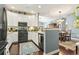 Open-concept kitchen with white cabinets flowing into the dining and living areas at 173 Knight Circle # 1, Pawleys Island, SC 29585