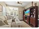 Cozy living room featuring a large entertainment center, comfortable seating, and a relaxed atmosphere at 173 Knight Circle # 1, Pawleys Island, SC 29585