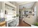 Comfortable home office space with built-in shelving, a desk, and an open view to the living room at 173 Knight Circle # 1, Pawleys Island, SC 29585