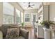 Bright sunroom with natural light, hardwood floors, and cozy seating for a relaxing retreat at 173 Knight Circle # 1, Pawleys Island, SC 29585