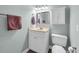 Bathroom featuring a white vanity, mirror, storage cabinet, and toilet at 178 Salt Marsh Circle # 30D, Pawleys Island, SC 29585